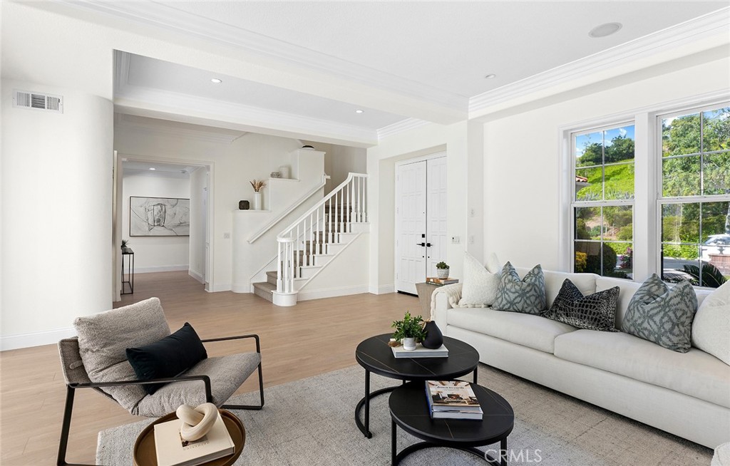 16 Meryton Irvine, CA 92603 - Photo 23 of 54 a living room with furniture and a potted plant