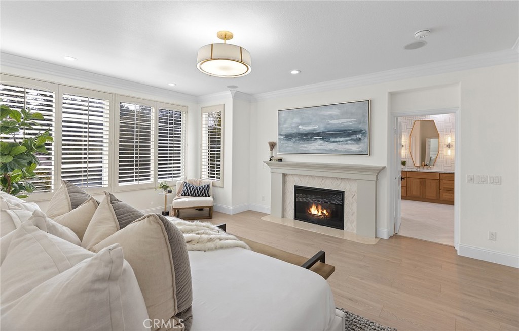 16 Meryton Irvine, CA 92603 - Photo 33 of 54 a living room with furniture large window and a fireplace