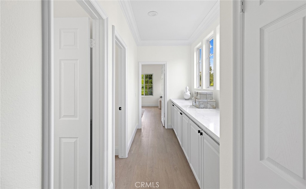 16 Meryton Irvine, CA 92603 - Photo 38 of 54 a bathroom with a double vanity sink and a mirror