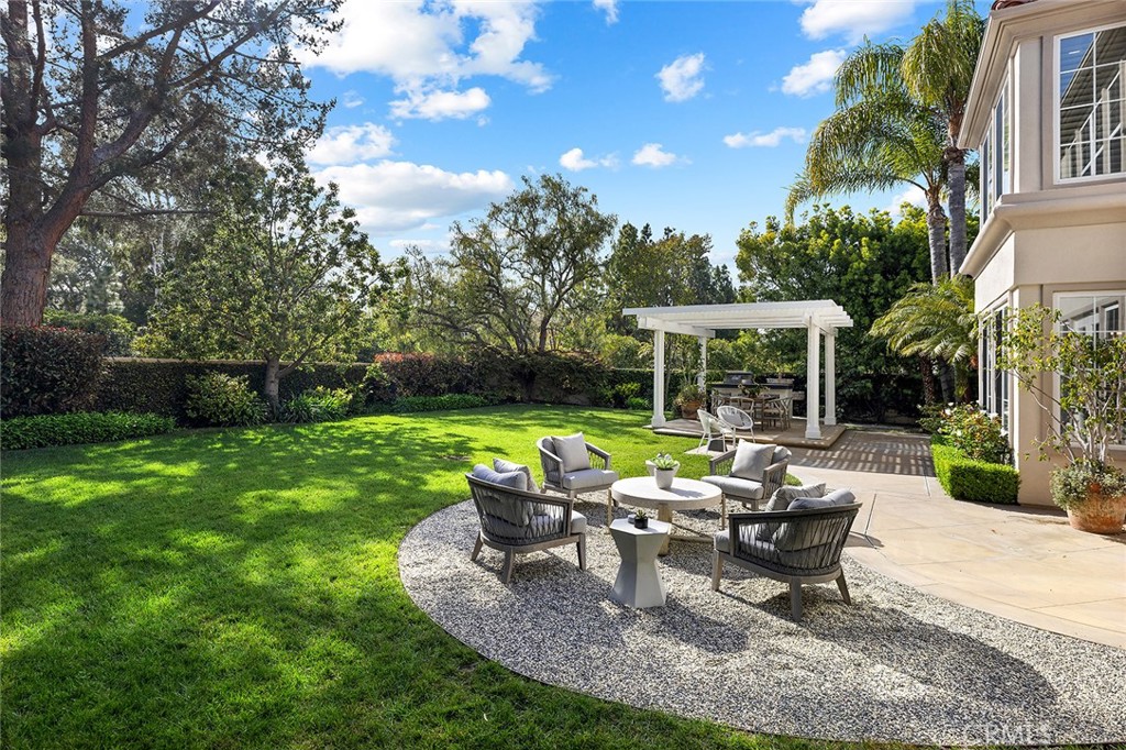 16 Meryton Irvine, CA 92603 - Photo 45 of 54 a view of a house with backyard sitting area and garden