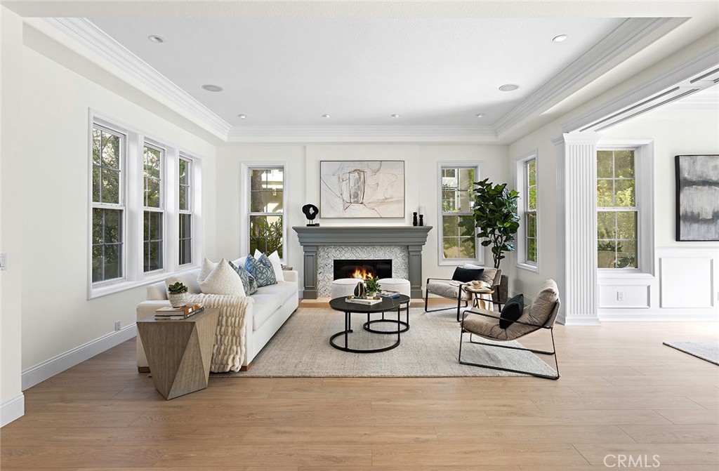 16 Meryton Irvine, CA 92603 - Photo 7 of 54 a living room with furniture and a fireplace