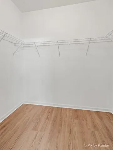 a view of a room with an empty walk in closet