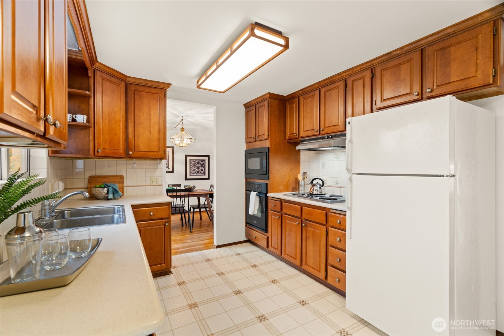 22039 98th Place West Edmonds, WA 98020 - Photo 12 of 32 a kitchen with stainless steel appliances granite countertop a refrigerator stove top oven a sink and dishwasher