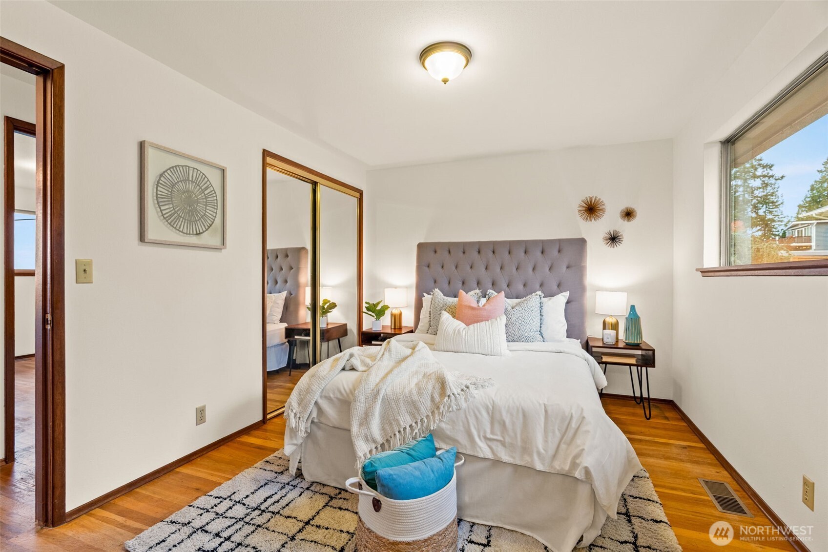 22039 98th Place West Edmonds, WA 98020 - Photo 14 of 32 a bedroom with a bed and wooden floor