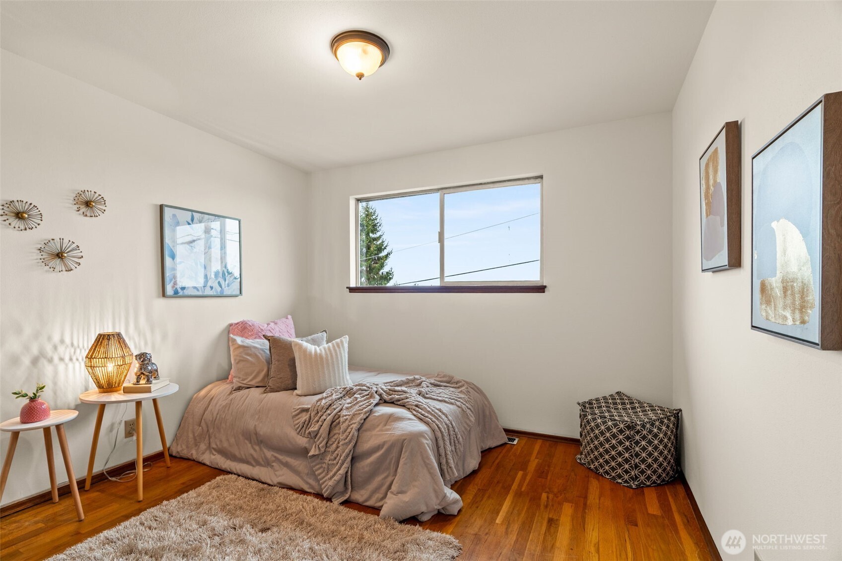 22039 98th Place West Edmonds, WA 98020 - Photo 17 of 32 a bedroom with a bed and wooden floor