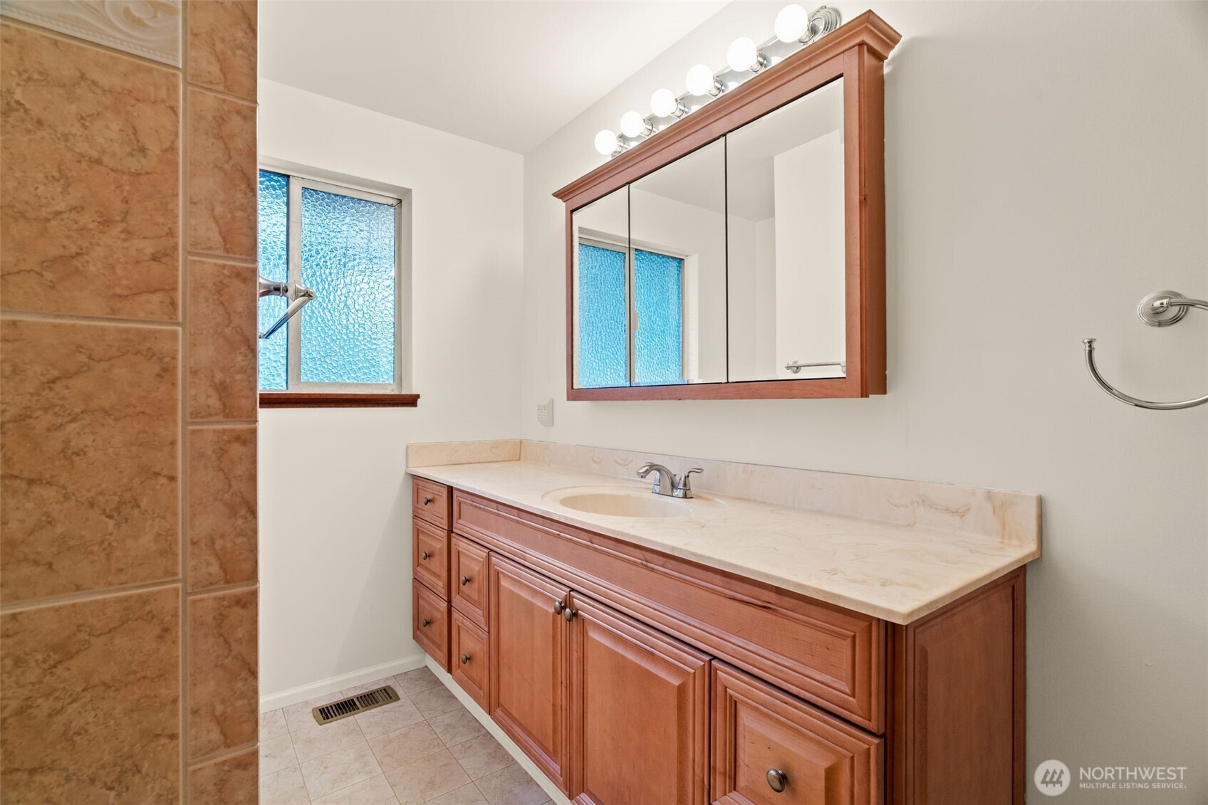 22039 98th Place West Edmonds, WA 98020 - Photo 18 of 32 a bathroom with a sink and a mirror