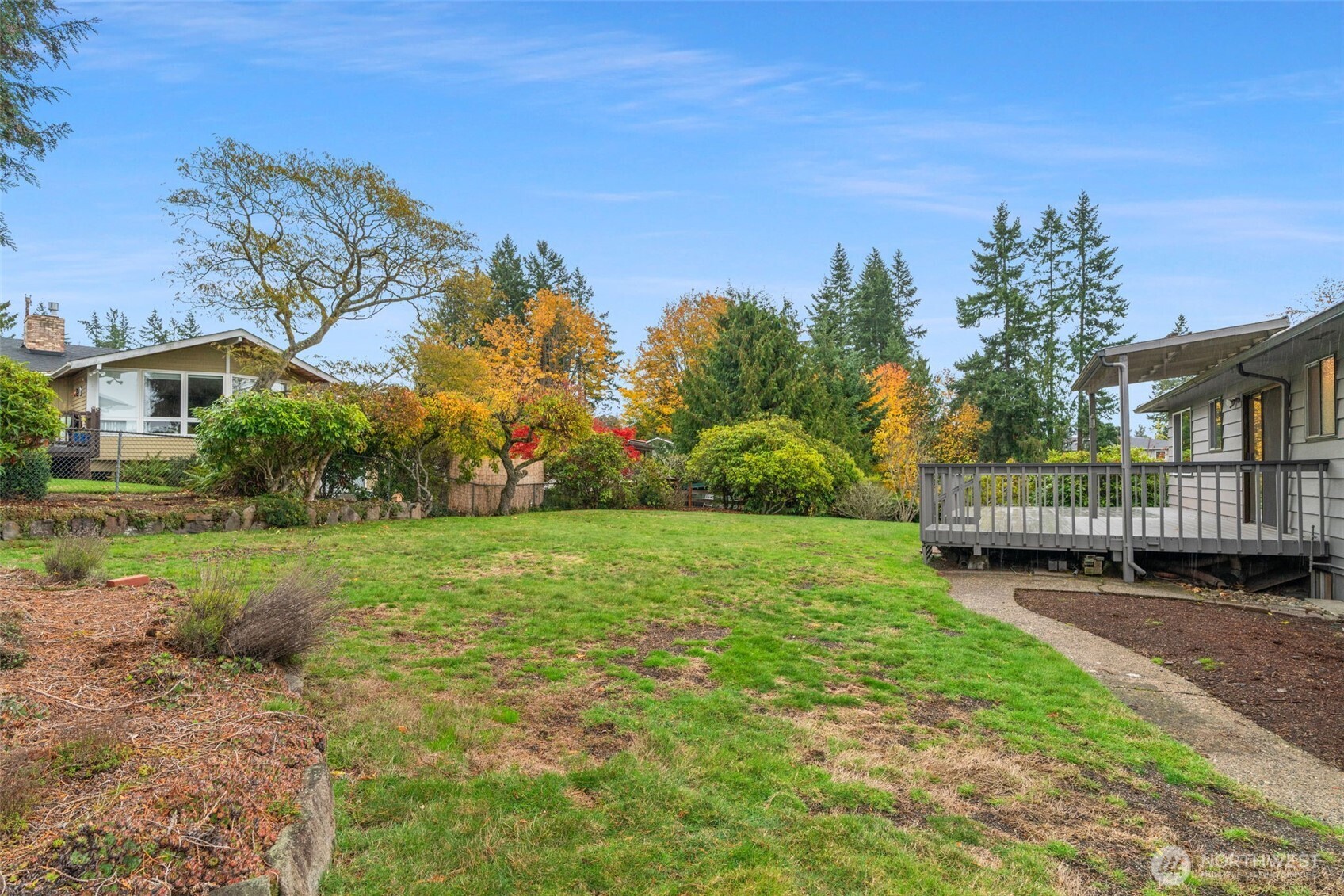 22039 98th Place West Edmonds, WA 98020 - Photo 29 of 32 a view of a house with a yard and a garden