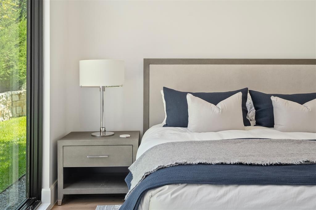 455 Sun Valley Mabank, TX 75147 - Photo 21 of 35 a bedroom with a bed and a night stand