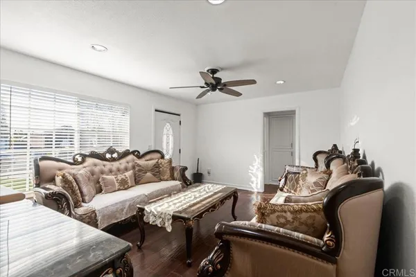 a living room with furniture and a window