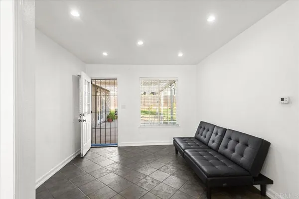 a living room with furniture and a window