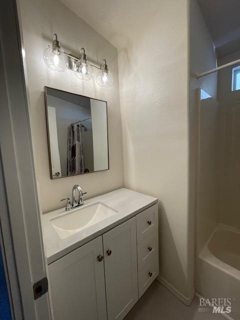 8156 D Street Windsor, CA 95492 - Photo 12 of 16 Remodeled bathroom has new flooring, vanity, light fixture and bathtub with shower.