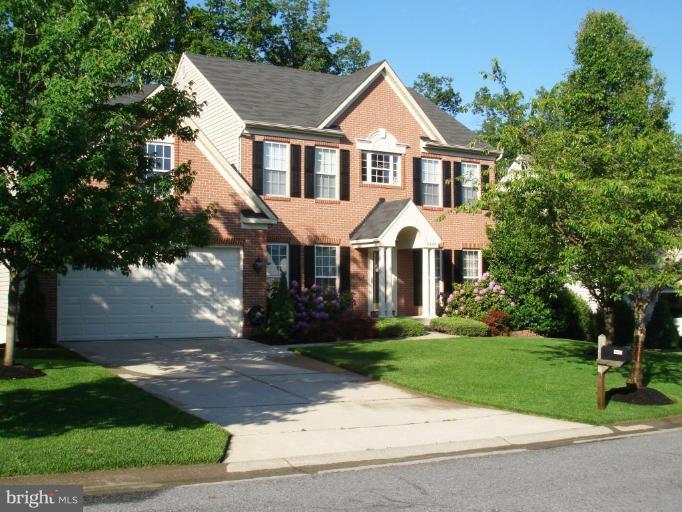 5957 Sandy Ridge Elkridge, MD 21075 - Photo 1 of 30 a front view of a house with a yard