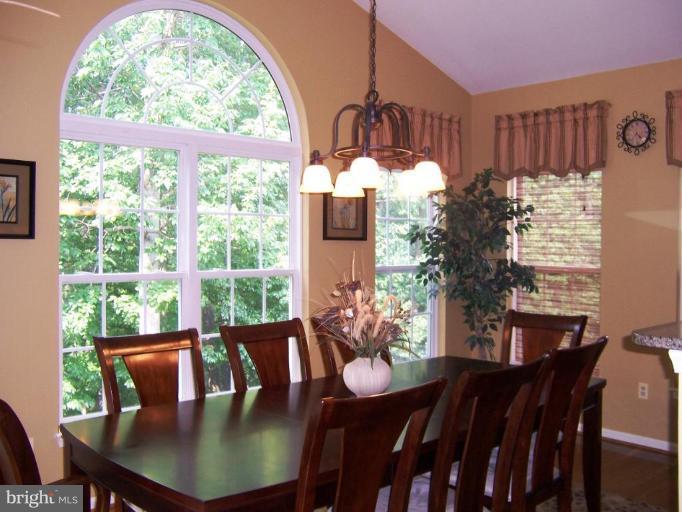 5957 Sandy Ridge Elkridge, MD 21075 - Photo 13 of 30 a view of a dining room with furniture window and outside view