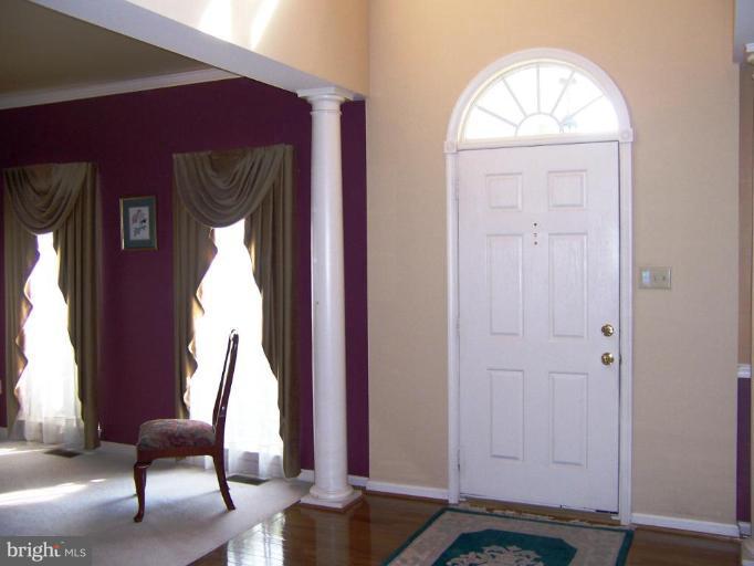 5957 Sandy Ridge Elkridge, MD 21075 - Photo 3 of 30 a view of front door with couch