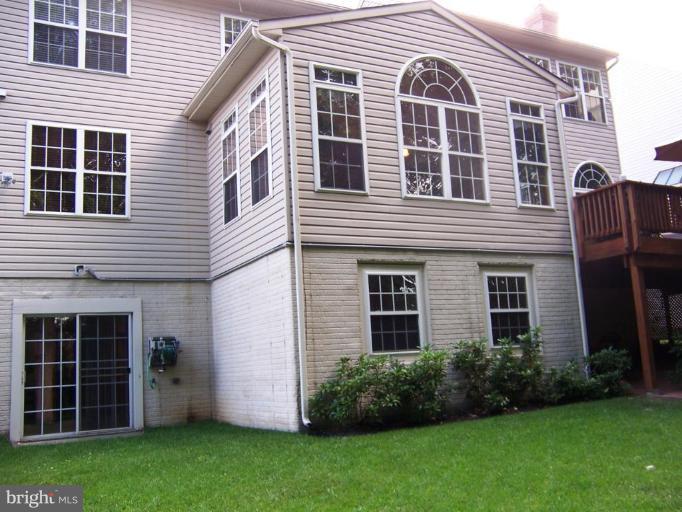 5957 Sandy Ridge Elkridge, MD 21075 - Photo 26 of 30 a front view of a house with a garden