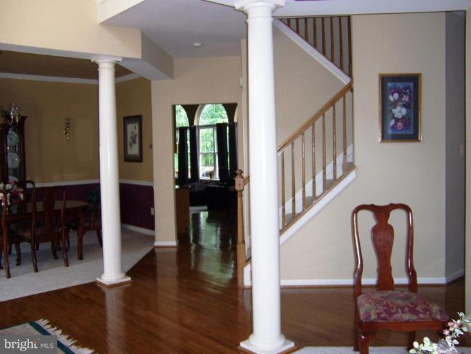 5957 Sandy Ridge Elkridge, MD 21075 - Photo 4 of 30 a view of entryway and hall with wooden floor