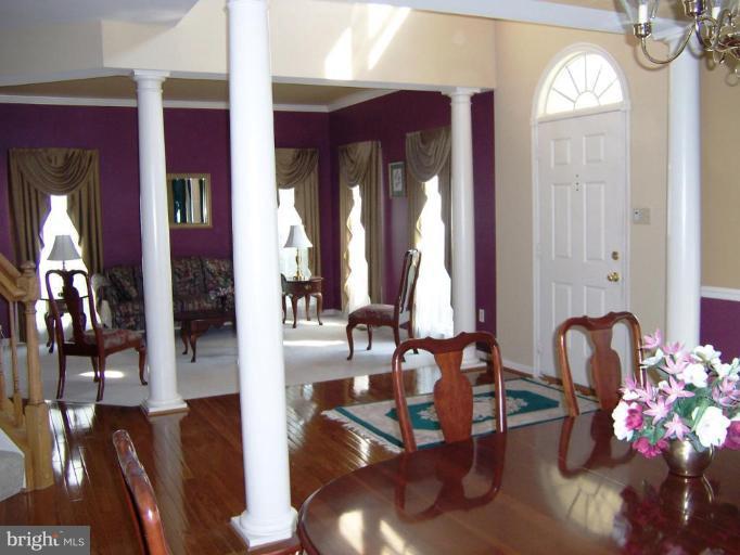 5957 Sandy Ridge Elkridge, MD 21075 - Photo 5 of 30 a view of living room filled with furniture and chandelier