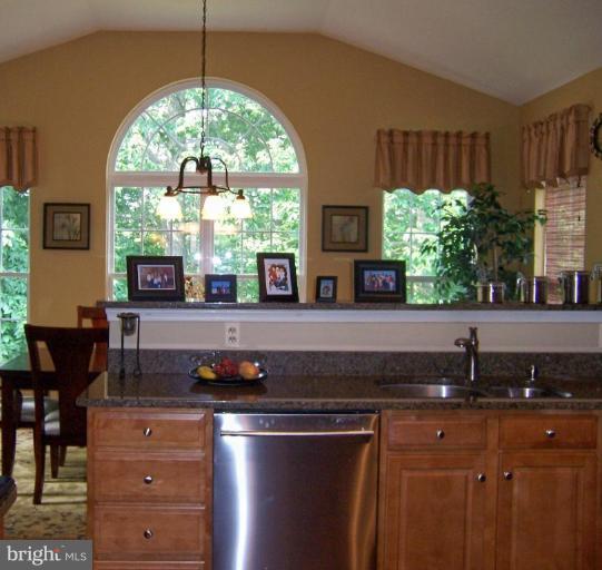5957 Sandy Ridge Elkridge, MD 21075 - Photo 8 of 30 a kitchen with a sink a window and cabinets