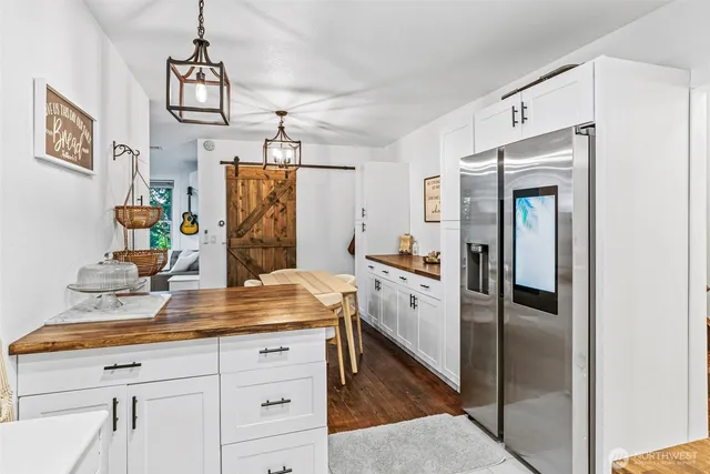 a view of kitchen with furniture wooden floor and window