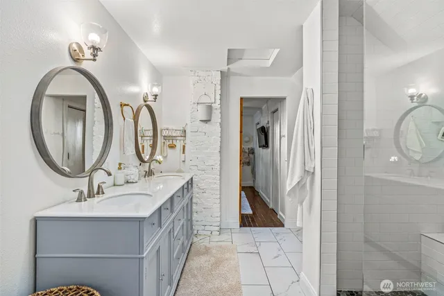 a bathroom with a sink toilet and shower
