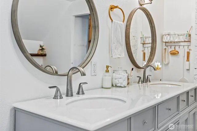 a view of a lake with chairs and a small yard