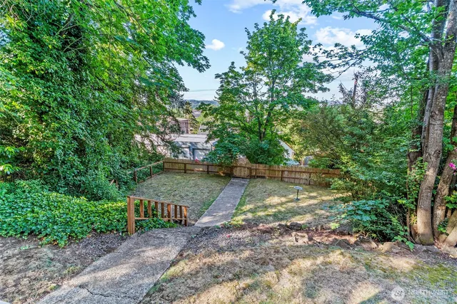 a view of a yard with entertaining space