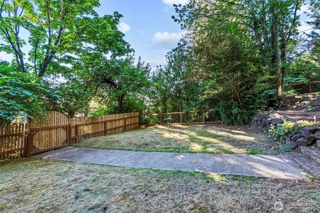 a backyard of a house with lots of green space
