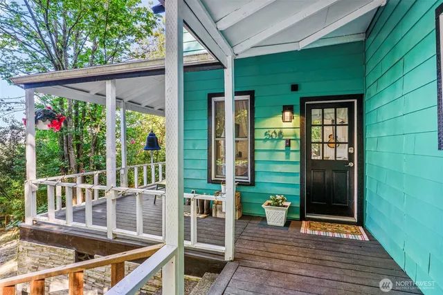 a view of balcony with wooden floor