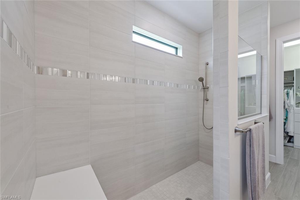 2703 Aviamar Circle Naples, FL 34114 - Photo 20 of 49 a bathroom with a shower and toilet