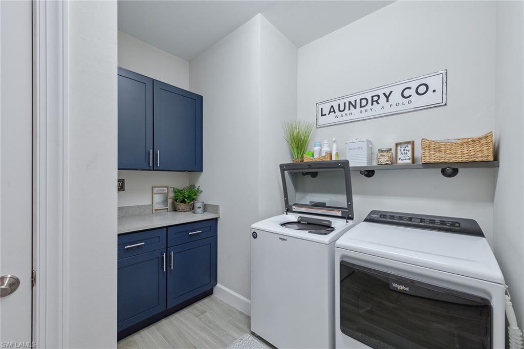 2703 Aviamar Circle Naples, FL 34114 - Photo 26 of 49 a utility room with washer and dryer