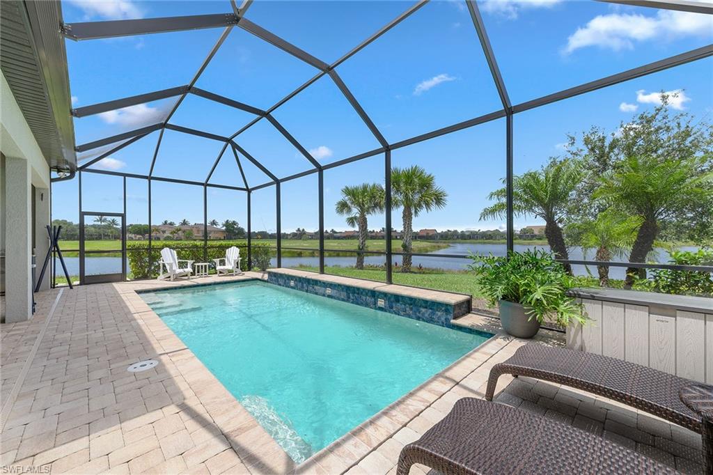 2703 Aviamar Circle Naples, FL 34114 - Photo 28 of 49 a view of swimming pool with seating area