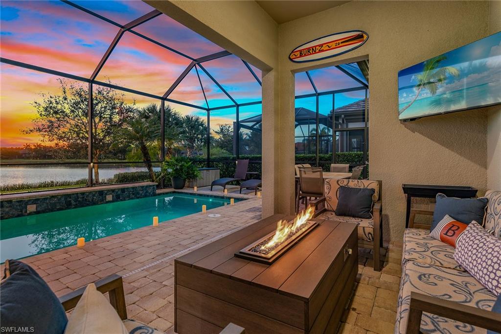 2703 Aviamar Circle Naples, FL 34114 - Photo 29 of 49 a view of a patio with a table and chairs