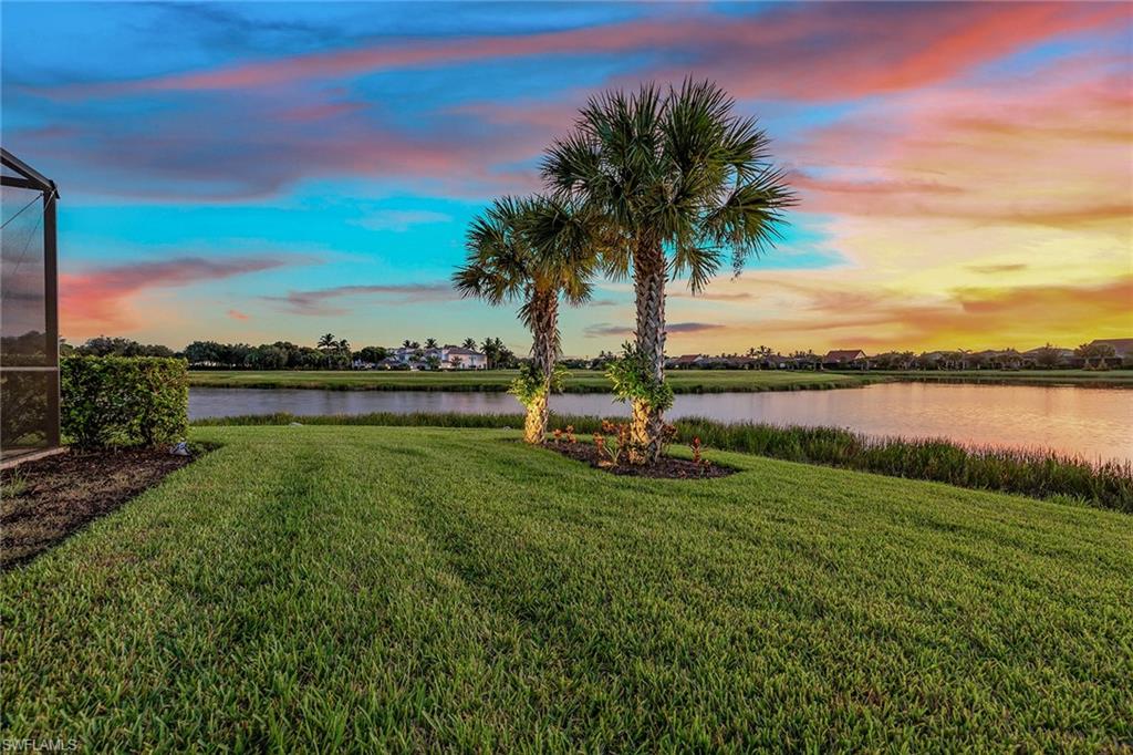 2703 Aviamar Circle Naples, FL 34114 - Photo 31 of 49 a view of a lake with a city