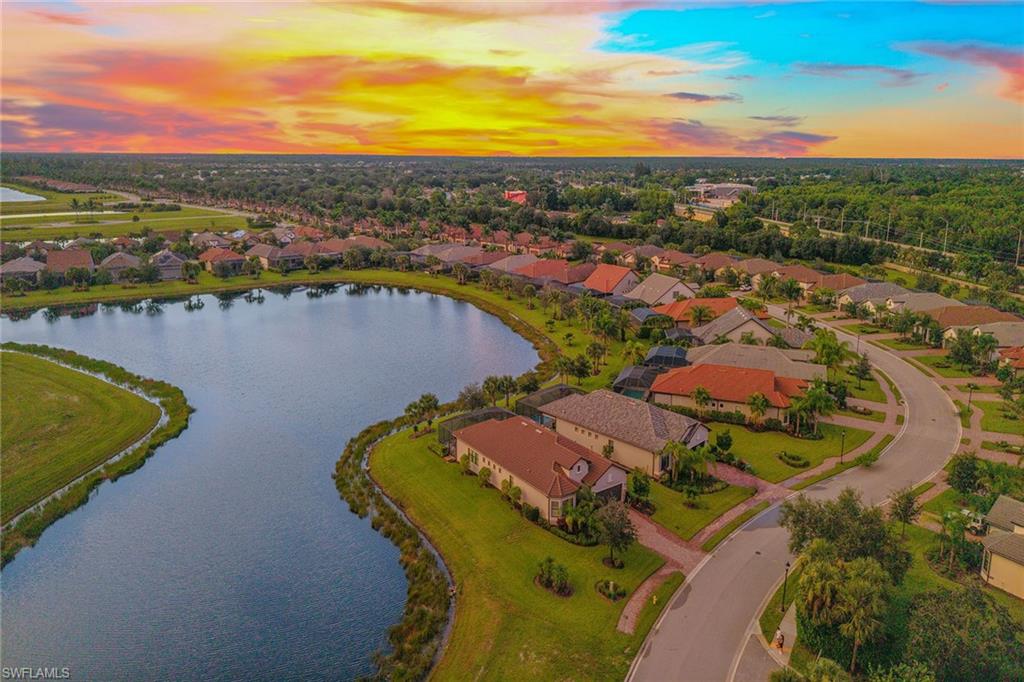 2703 Aviamar Circle Naples, FL 34114 - Photo 35 of 49 a view of a lake with a city