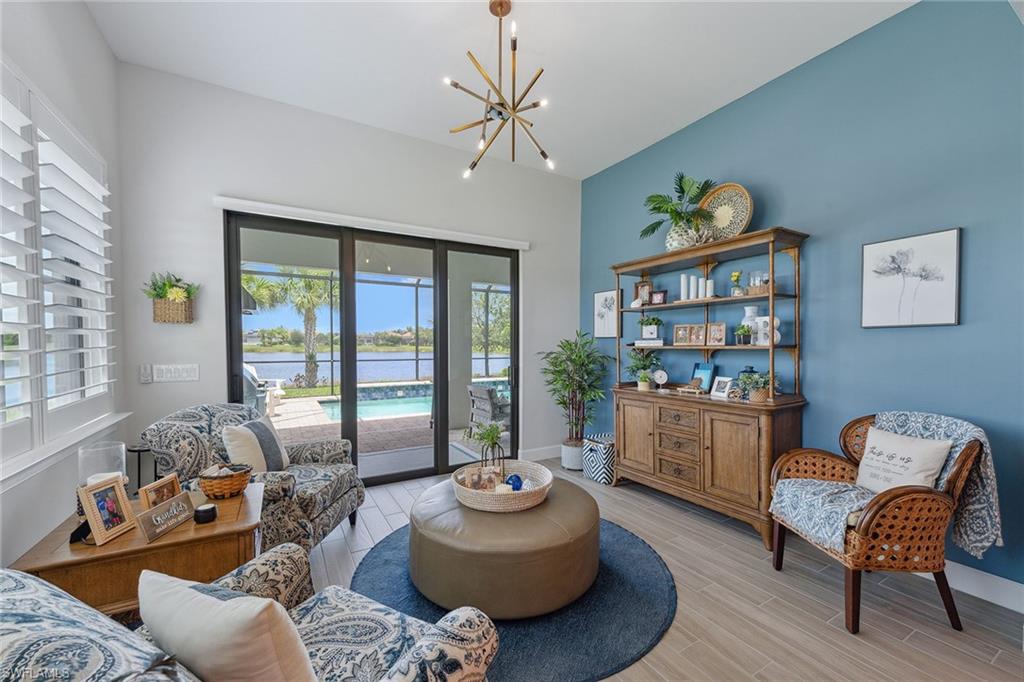 2703 Aviamar Circle Naples, FL 34114 - Photo 4 of 49 a living room with furniture and a large window