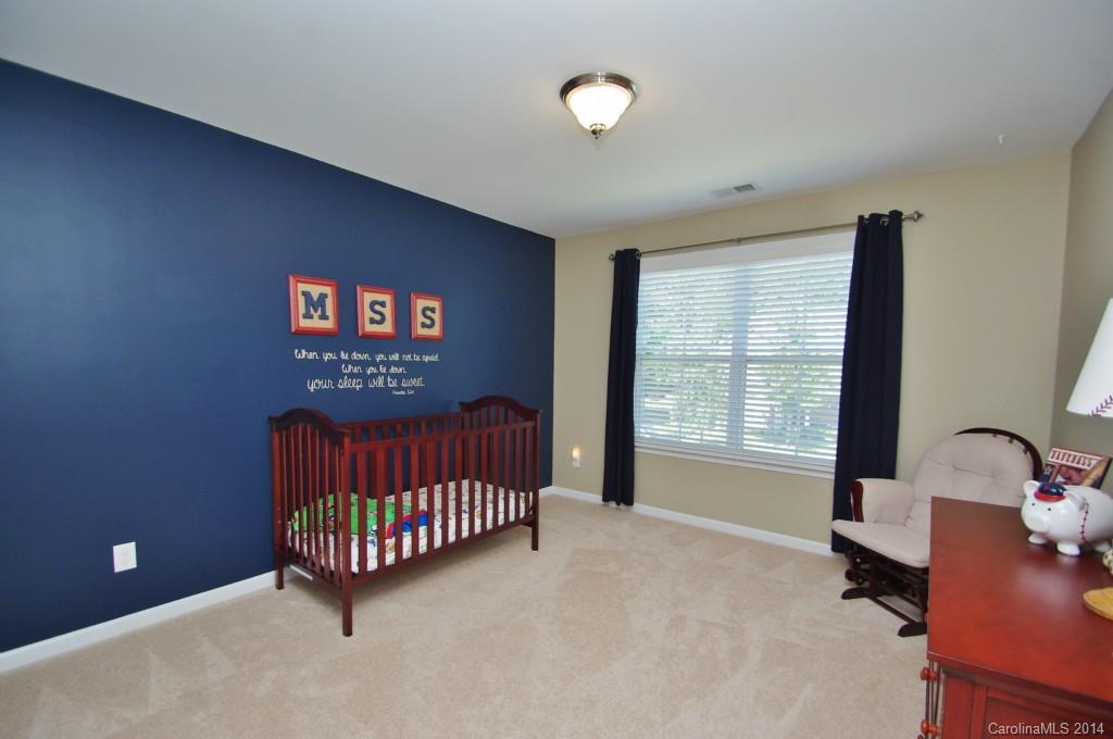 1301 Ridgehaven Road Waxhaw, NC 28173 - Photo 15 of 24 a view of a room with a window and a projector screen