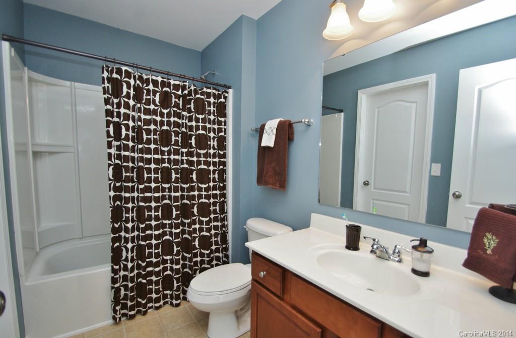 1301 Ridgehaven Road Waxhaw, NC 28173 - Photo 17 of 24 a bathroom with a sink toilet and shower