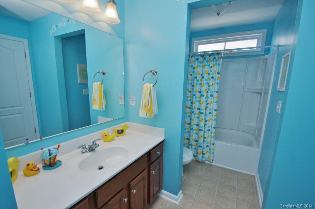 1301 Ridgehaven Road Waxhaw, NC 28173 - Photo 19 of 24 a bathroom with a sink vanity and a mirror