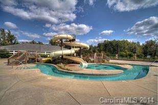1301 Ridgehaven Road Waxhaw, NC 28173 - Photo 22 of 24 a view of a swimming pool with a yard