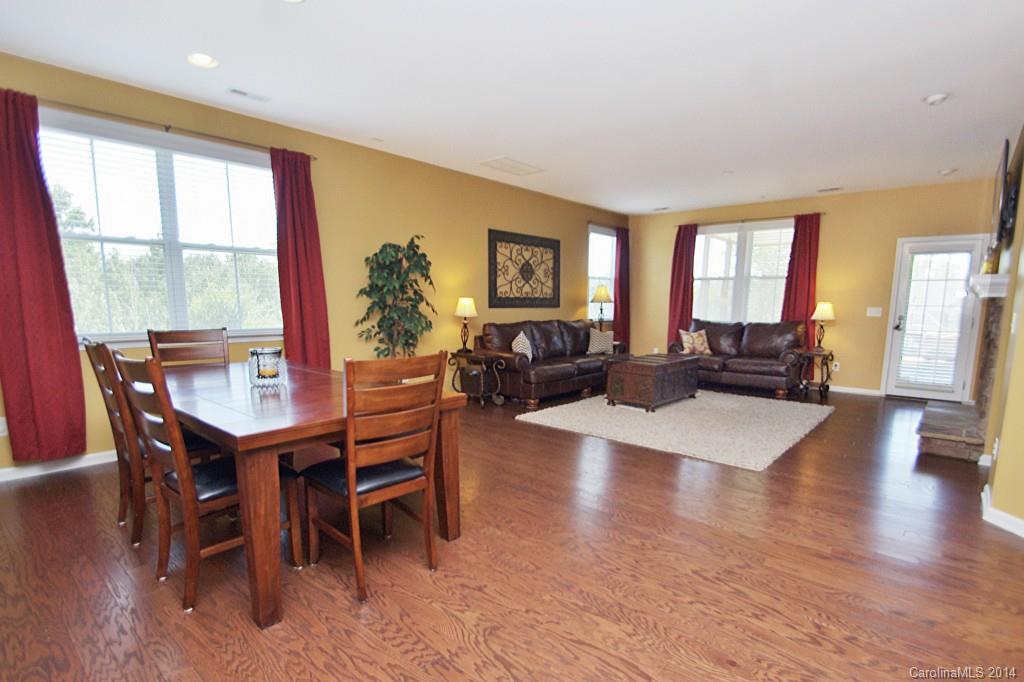 1301 Ridgehaven Road Waxhaw, NC 28173 - Photo 9 of 24 a view of a dining room with furniture window and wooden floor