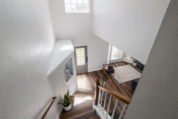 a view of an entryway with wooden floor