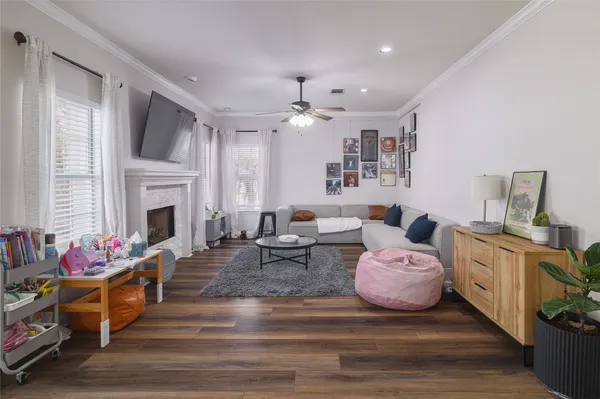 a living room with furniture fireplace and flat screen tv