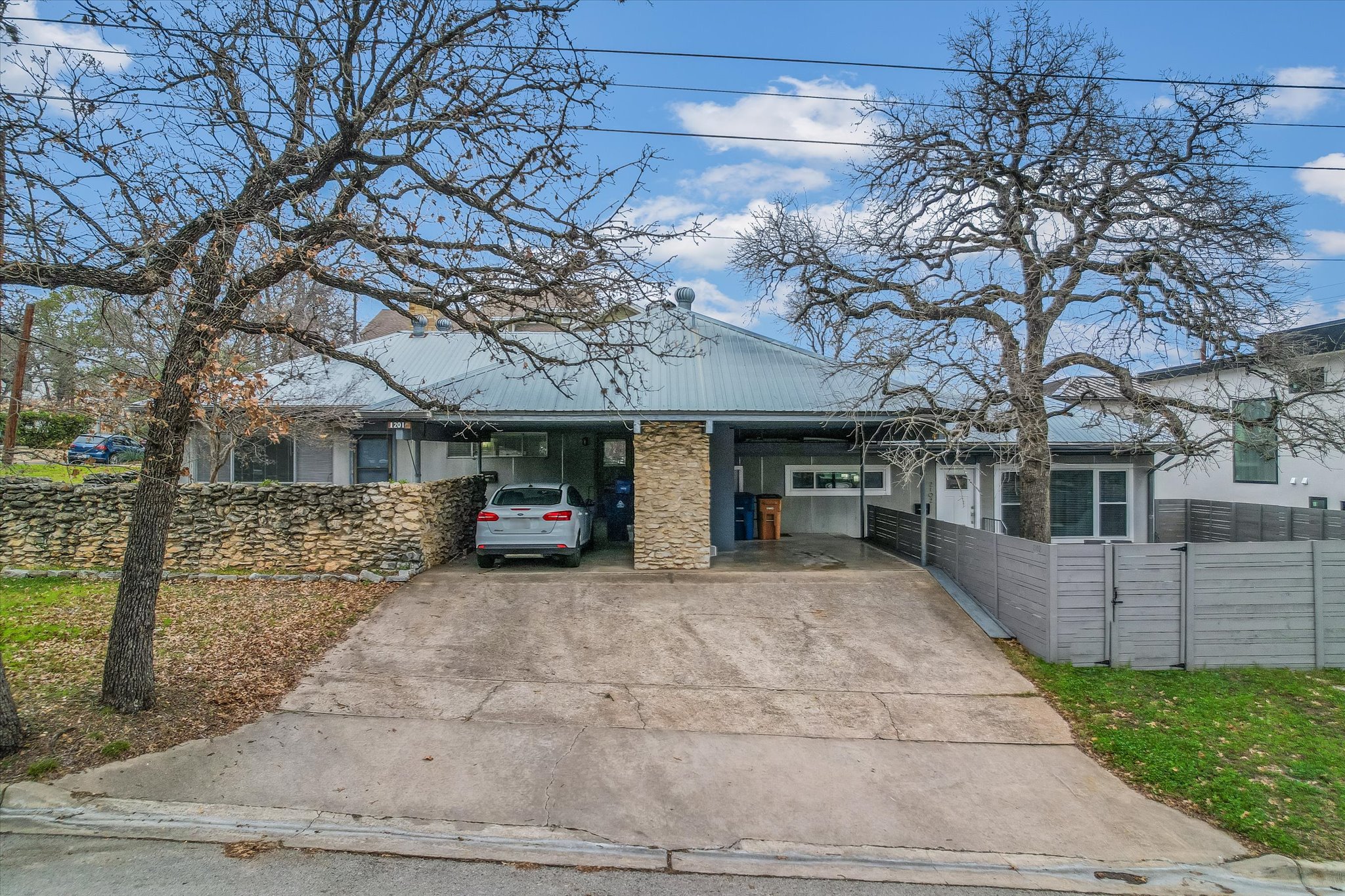 a view of a house with a yard and garage