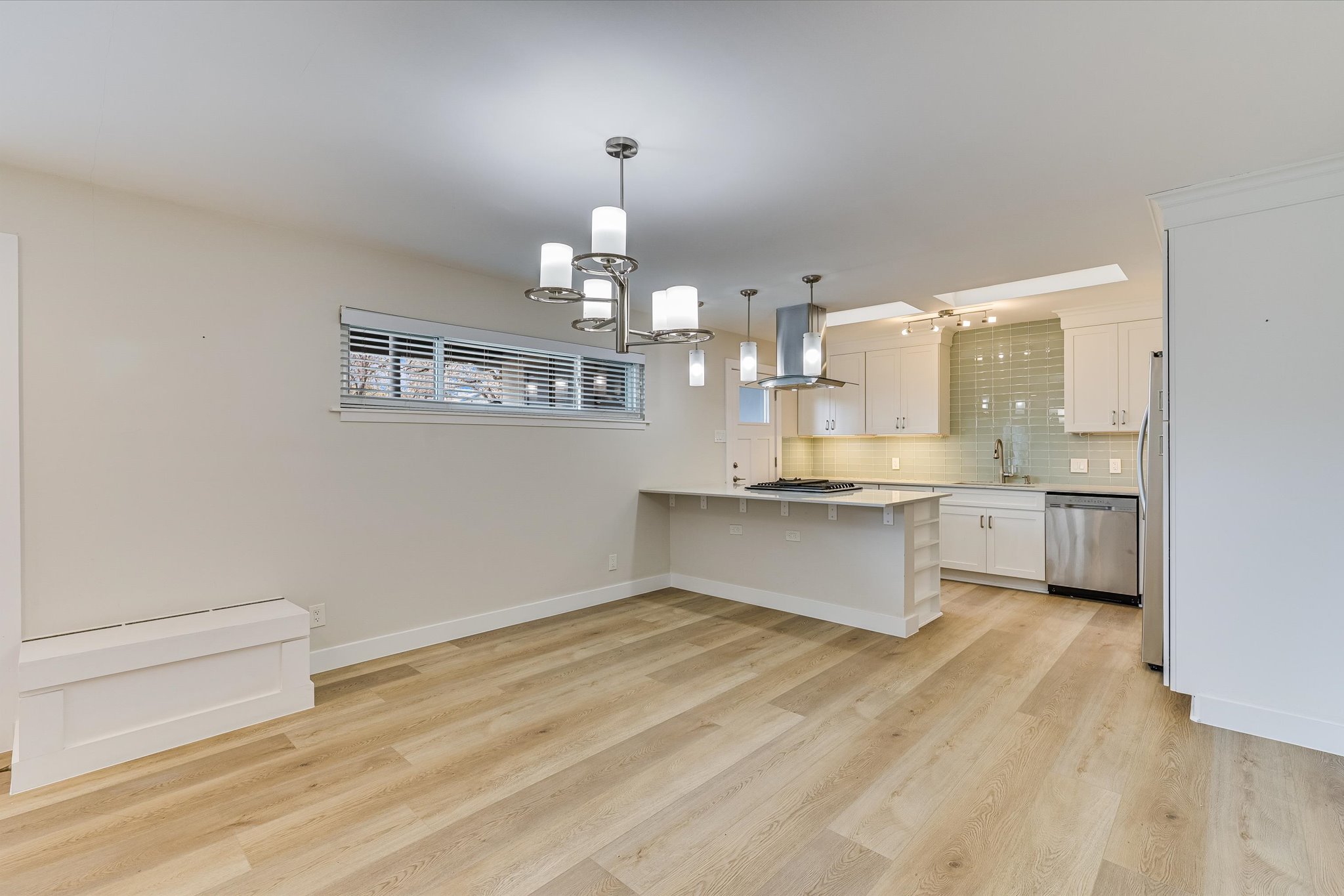 1201 Dailey Street Austin, TX 78703 - Photo 6 of 14 a large kitchen with kitchen island a sink stainless steel appliances and cabinets