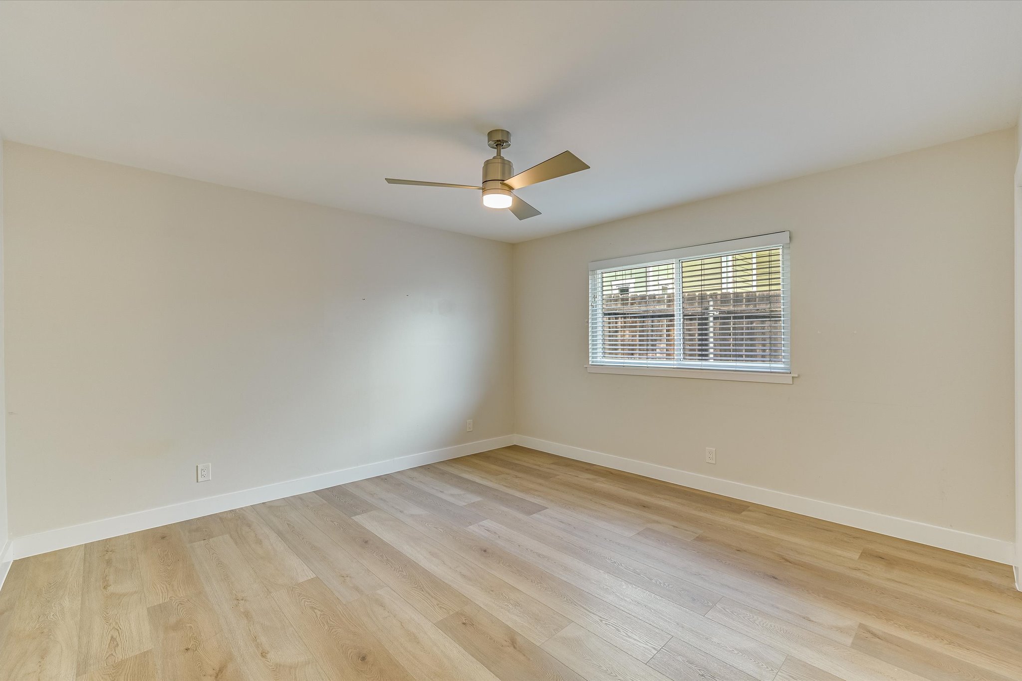 1201 Dailey Street Austin, TX 78703 - Photo 10 of 14 a view of empty room with wooden floor and fan