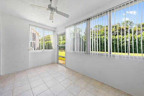 a view of an empty room and window