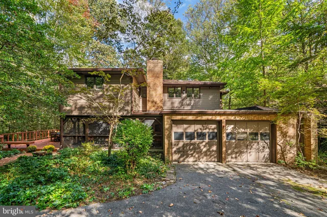 front view of a house with a tree in front