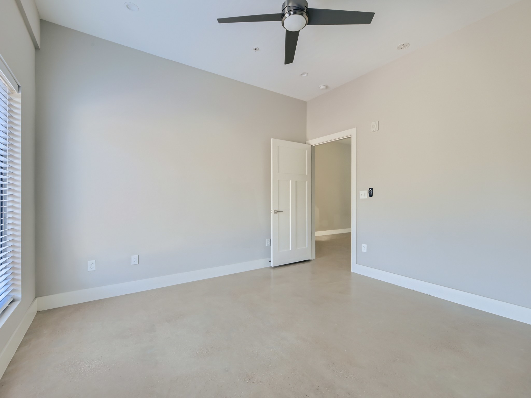 3523 Gonzalez Street, Unit 200 Austin, TX 78702 - Photo 8 of 10 Spacious room featuring a vaulted ceiling with a modern ceiling fan, recessed lighting, and light-toned flooring