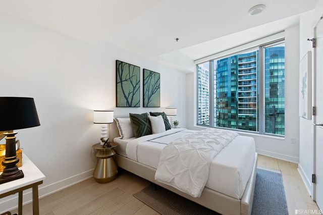 a bedroom with a bed and a mirror