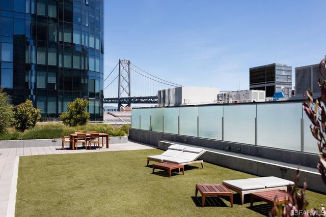a balcony with furniture and flowers